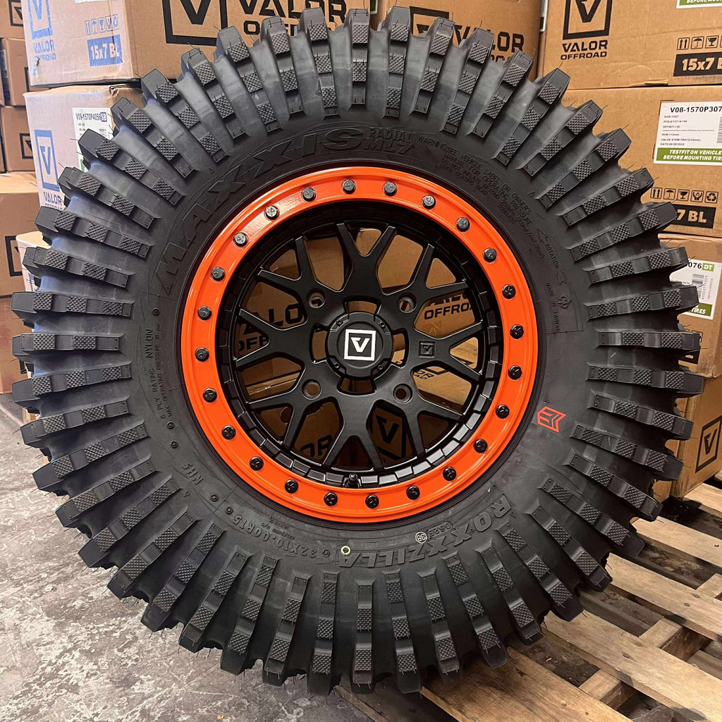 Valor V07 Satin Black w/ Orange Rings Beadlock  + Maxxis Roxxzilla Tires (Mounted Kit) – 15x7 | 4/156 Bolt Pattern | Rock-Ready Combo