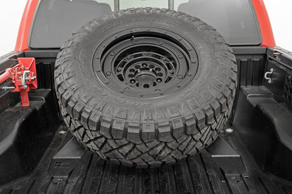 Bed Mount Spare Tire Carrier | Universal (5x5.5 6x5.5 6x135 & 5x5.0 Bolt Patterns) | 73110