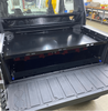 Polaris Xpedition Bed Tray by AJK Offroad  Back Left Angle View Mounted Lower with Bed Drawer Closed with Two Loadout Kits and Tailgate Open 