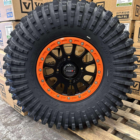 System 3 SB5 Beadlocks 4/137 Matte Black w/ Custom Orange rings mounted on Maxxis Roxxzillas