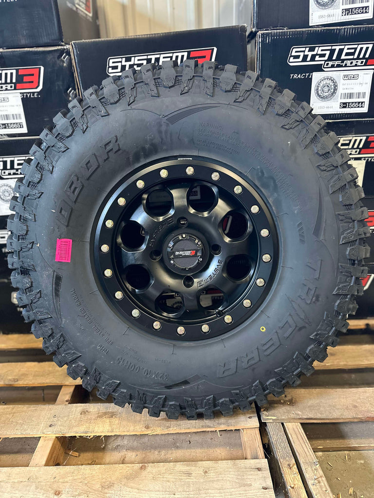 System 3 SB7 4/137 6+1 matte black beadlocks on 32x10-15 Obor Tricera tires