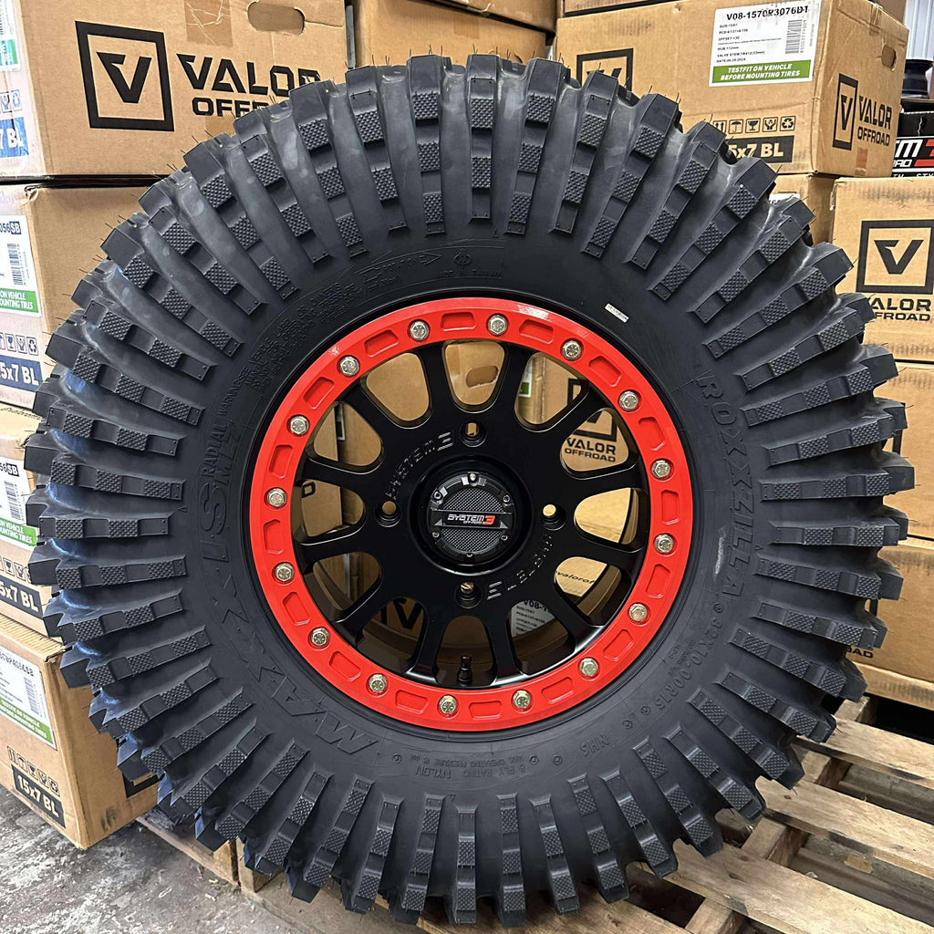 System 3 SB5 Beadlocks 4/156 Matte Black w/ Custom Red rings mounted on Maxxis Roxxzillas