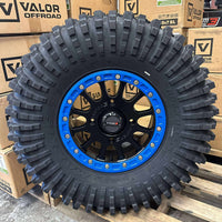 System 3 SB5 Beadlocks 4/156 Matte Black w/ Custom Blue rings mounted on Maxxis Roxxzillas