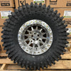 Valor V09 Raw Machined Beadlock 15x10 Mounted on Maxxis Roxxzillas | 4/137 Bolt Pattern