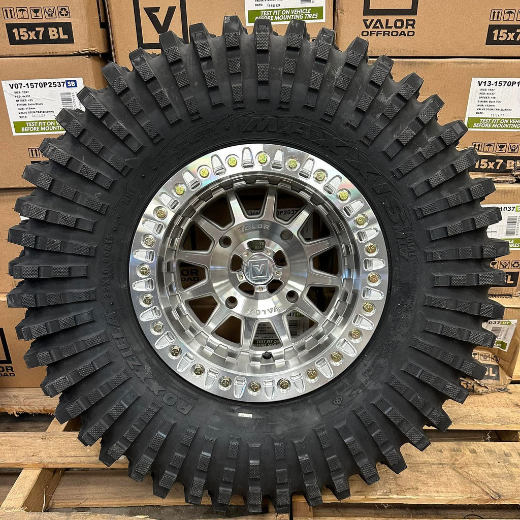 Valor V09 Raw Machined Beadlock 15x10 Mounted on Maxxis Roxxzillas | 4/137 Bolt Pattern