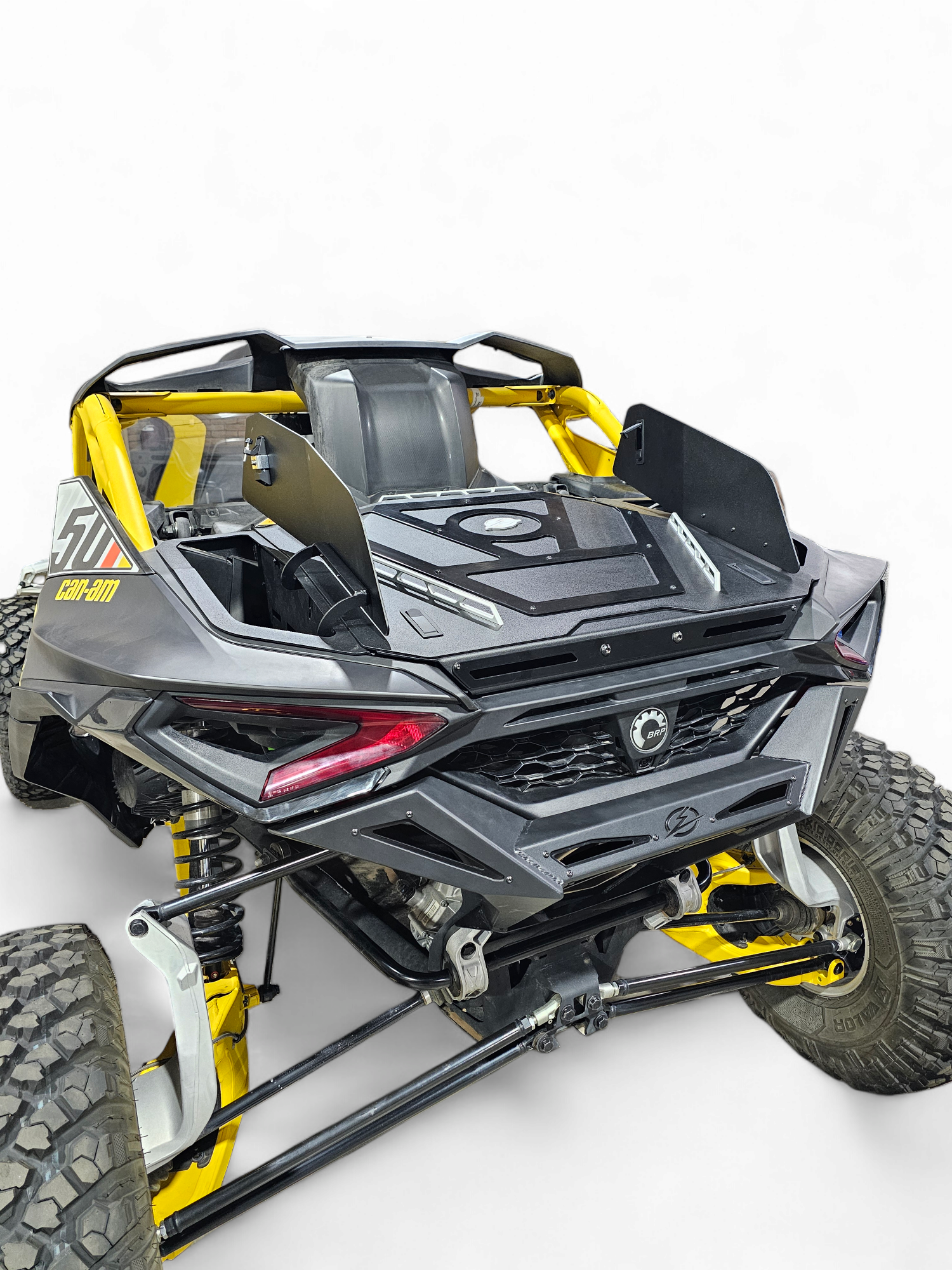 Rear Volt Bumper on 2024 Can-Am Maverick R 2-Door from driver's side rear quarter angle showing angular steel profile and aggressive stance