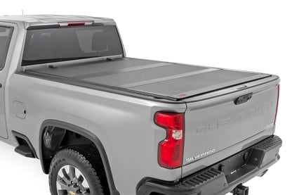 Hard Tri-Fold Flip Up Bed Cover | 6'9" Bed | Chevy/GMC  Silverado/Sierra 2500HD/3500HD (20-25) | 49120651