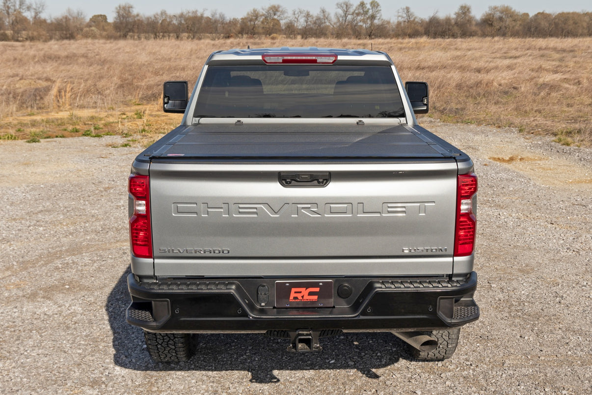 Hard Tri-Fold Flip Up Bed Cover | 6'9" Bed | Chevy/GMC  Silverado/Sierra 2500HD/3500HD (20-25) | 49120651