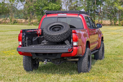 Bed Mount Spare Tire Carrier | Universal (5x5.5 6x5.5 6x135 & 5x5.0 Bolt Patterns) | 73110