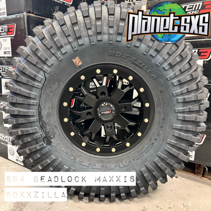 System 3 SB4 Matte Black Beadlocks + Maxxis Roxxzilla Tires (Mounted UTV Kit) | 4/156 PlanetSXS